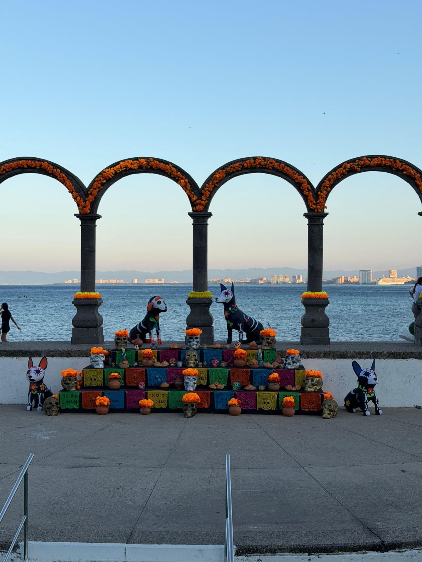 The Malecón arches on the Puerto Vallarta seafront, dressed with marigolds for Día de Muertos