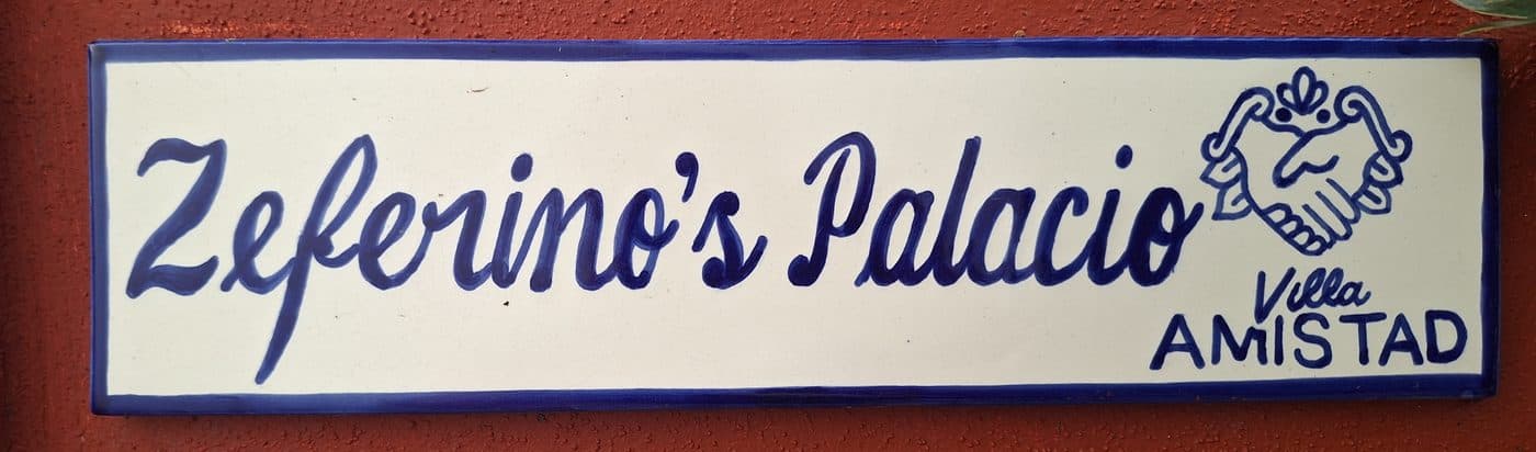 The hand-painted sign reading Zeferino's Palacio beside Mark's own front door at Villa Amistad